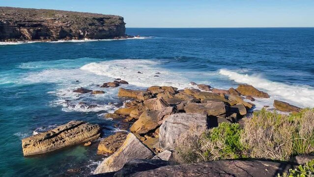 HD Video -Beautiful view from above of waves splashing on rocks at Wattamolla, from the coastal walking trail to Providential Point lookout in Royal National Park, located South of Sydney, NSW, Austra