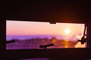View from caravan inside on sunrise landscape