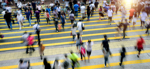 Busy people on zebra crossing street in Hong Kong, China