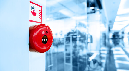 Manual push station of fire alarm system, installed on the wall of shopping center - obrazy, fototapety, plakaty