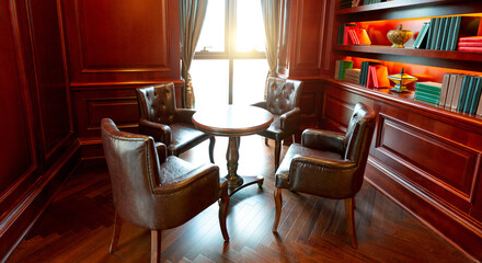 Old studying room with four leather armchairs and wooden table