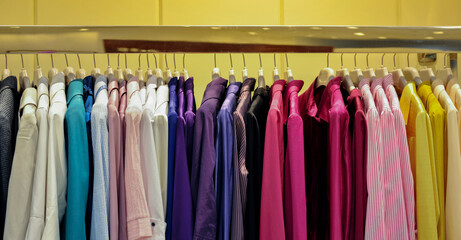 Collection of women's clothes hanging on rack