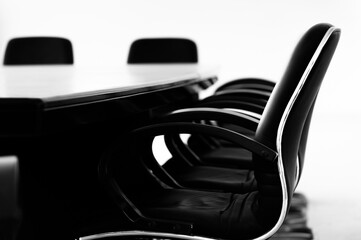 Conference table and chairs in empty meeting room