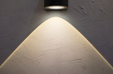 Decorative lighting decorates the walls and shadows the empty space for design work.