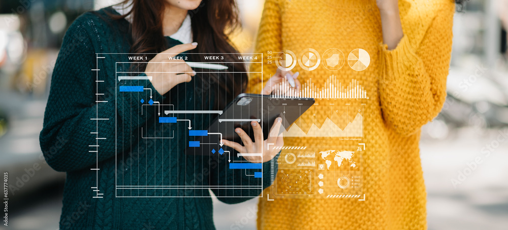 Aufkleber two businesswoman project manager working and update tasks and gantt chart scheduling virtual diagra