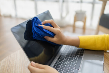 People are using laptop wipes on their desks, using cleaners and wipes on their desks, preventing...