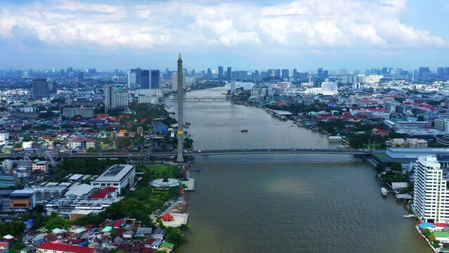 Aerial View Of Cars Crossing The Rama VIII Bridge Over The Chao Phraya River In Bangkok, Thailand.