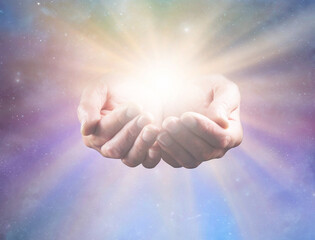 Connect with Divine Intelligence - and All That Is - mature male healers cupped hands with bright...