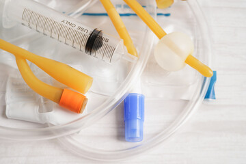 Foley catheter and urine drainage bag collect urine for disability or patient in hospital. - obrazy, fototapety, plakaty