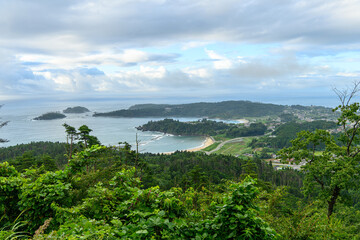 Fototapeta na wymiar 気仙沼大島の亀山展望台から望む小田の浜海水浴場方面