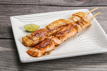 Grilled salmon skewer with sauce