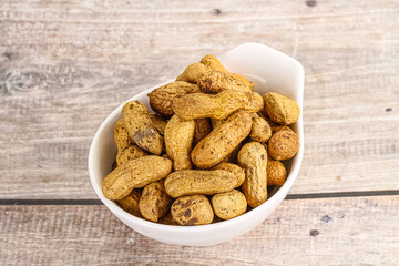 Raw ripe unpeeled peanut heap