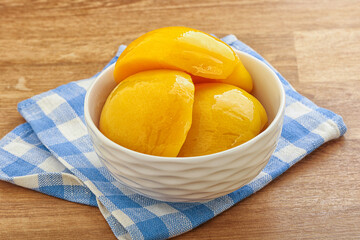 Sweet canned peaches with syrope