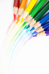 Drawn rainbow with pencils and colored pencils on a white background. Background, wallpaper. Hand-drawn.Close up. Isolated on white. Colorful pencils with hand-drawn lines. Diversity 