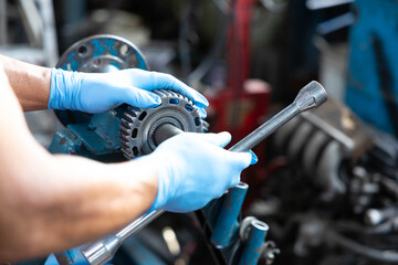 close up factory worker or technician hands working and control lathe machine in factory