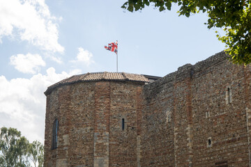 A flag above Colchester Castle, Essex, UK