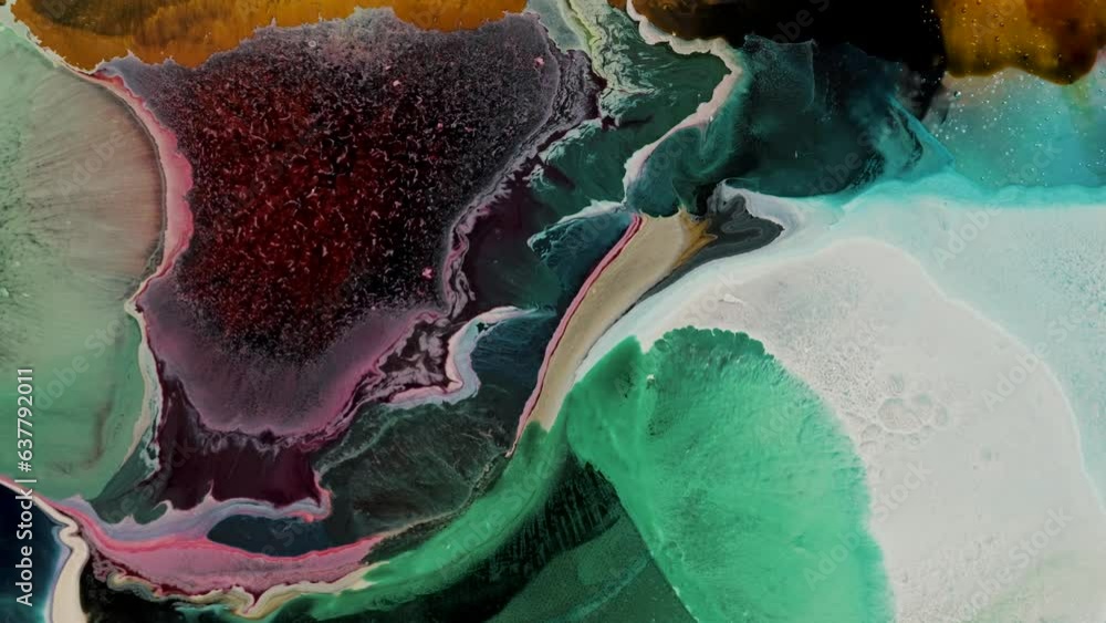 Poster colored paints spreading and mixing smoothly on a surface. abstract, macro