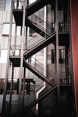 Metal staircase, ladder behind a building. Stairway