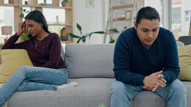 Couple, counseling and talking about conflict on sofa in argument or discussion of divorce in living room with sad crying. Frustrated, woman and man with confession of cheating, mistake and breakup