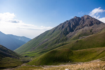 Fototapeta na wymiar On the right is the Big Almaty Peak, on the left is the gorge called Prokhodnoe