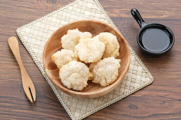 Cireng, a savory snack from West Java, Indonesia, made from tapioca flour and deep-fried, served with a spicy sauce.
