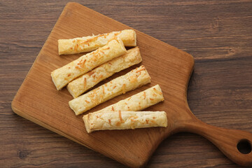 Cheese Stick Pastry served on chopping board