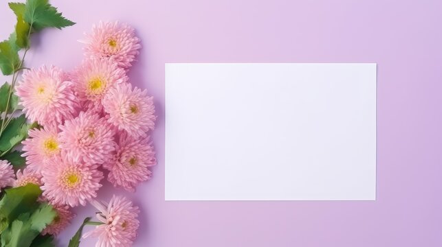 Flower themed greeting card template with blank paper on green table. Mockup image