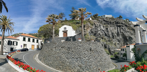 Panoramic view at the St. António church on Ponta do Sol, a small touristic village in the city of Funchal, buildings and cliffs, Madeira Island, Portugal - obrazy, fototapety, plakaty