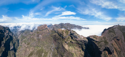 Amazing panoramic view at the top at the mountains Pico do Areeiro and Pico Ruivo, low clouds, Madeira Island, Portugal