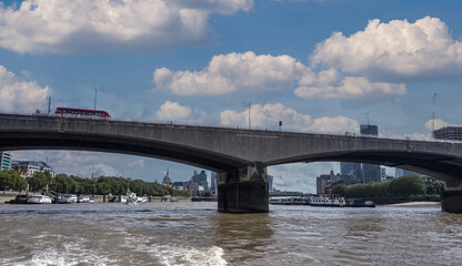 A view of Waterloo Bridge taken from a river boat on the River Thames in London, UK