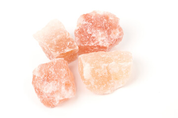 Himalayan salt stone block, crystal of natural pink salt isolated on white background