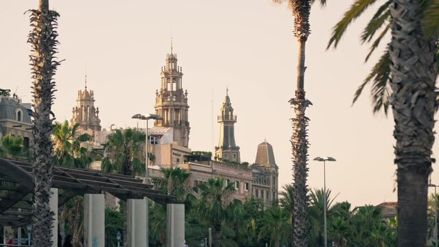 A vibrant cityscape with towering buildings and palm trees in the beautiful city of Barcelona