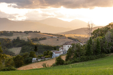 Sunrise over the hills of the village of Santo Stefano in the province of Ancona in the Marche region of Italy.