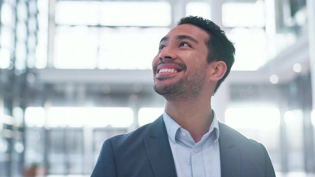 Smile, vision and a businessman in an office building for opportunity, work and a new job. Happy, corporate and a young Asian employee looking at a workplace, thinking and admiring professional space