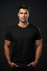 Man in black tshirt isolated on black background.