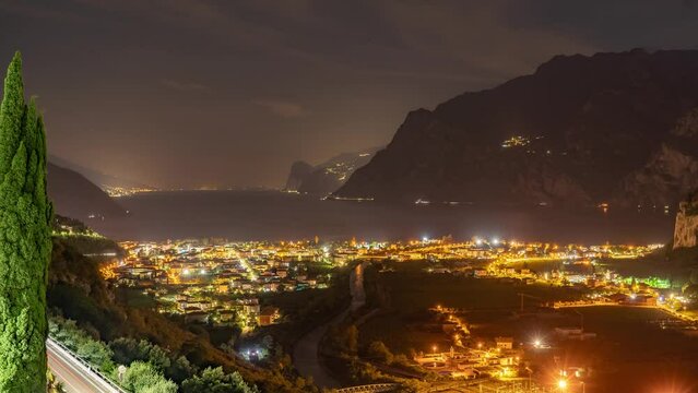 Night timelapse of the city in the mountains