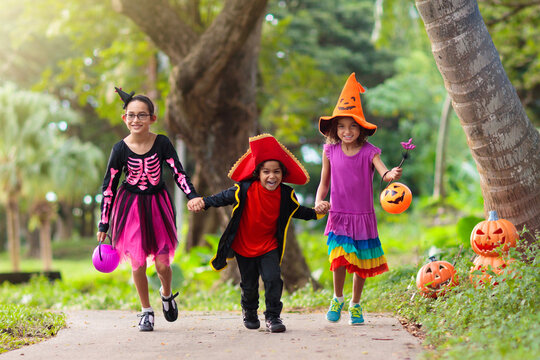 Kids trick or treat. Halloween fun for children.