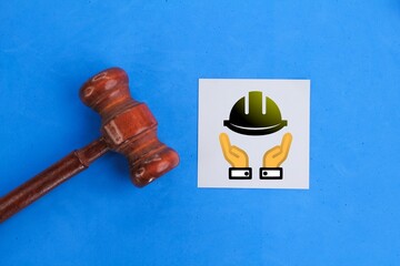 lawyer hammer and white paper with labor laws icon. The concept of labor law.