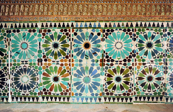 Arab tiles socle and plasterwork inside the Mudejar chapel of St. Bartholomew (San Bartolom&eacute;). Cordoba, Andalusia, Spain. Alicatados mosaic
