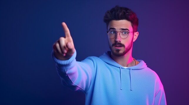 Stylish young professor pointing fingure with an blue & purple gradient background. Concept of human emotions, facial expression, sales, ad.