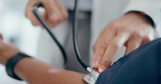 Doctor, patient and stethoscope on arm for blood pressure, healthcare consultation and test in clinic. Closeup, hands and medical expert check pulse, hypertension and wellness analysis in hospital