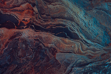 natural stone in the rocky mountains, the texture of slate and stone ore close-up.