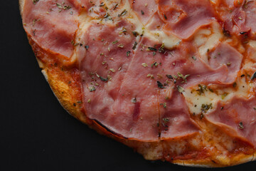 Delicious pizza prosciutto with ham and mozzarella