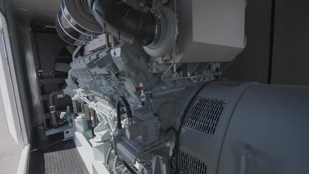 Detailed shot of diesel generator engine. Diesel electric generator engine close-up. Industrial diesel power generator close-up