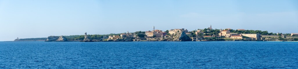 Italy Archipelago Toscano Livorno, visit to the island of Pianosa, arrival from the sea on the island panoramic view of the coast profile - obrazy, fototapety, plakaty
