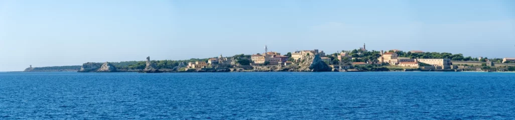 Tuinposter Italy Archipelago Toscano Livorno, visit to the island of Pianosa, arrival from the sea on the island panoramic view of the coast profile © Roberto