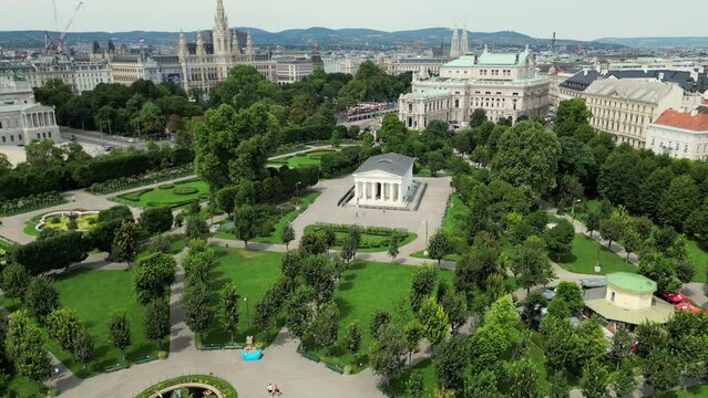 Cathedrals and cityscape City of Vienna, Austria. City center of Vienna. Europe landscape panorama from above. Flight Above Volksgarten to St Stephen's Cathedral in Austria's Capital City