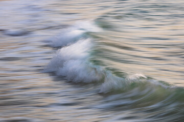 Motion of breaking wave on the beach shore.