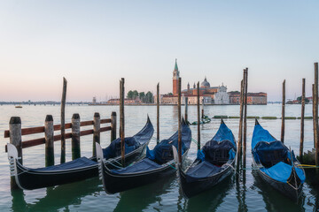 Sunrise in San Marco square, with gondolas on the Venice Grand Canal, Venice, Italy