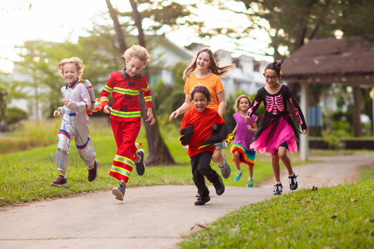 Kids trick or treat. Halloween fun for children.
